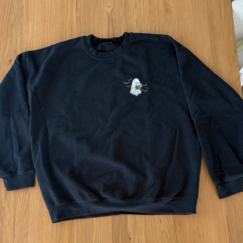 XL black crewneck sweat shirt with ghost reading, worn